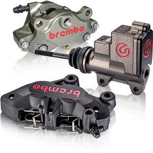 Three Brembo brake calipers for motorcycles in black and silver with red logos.